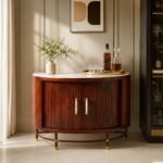 Zelvarique curved fluted solid wood bar cabinet in rich brown finish with gold-tone accents and sculpted front