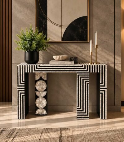 Bone Inlay Console Table with black and ivory geometric maze pattern, circular mother-of-pearl detailing and sculptural legs.
