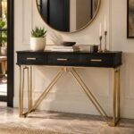 Black and Gold Console Table with three drawers, gold handles and geometric iron legs.