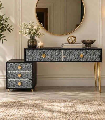 Bone Inlay Vanity Console with black and white geometric drawers, gold-toned knobs and slender gold legs.